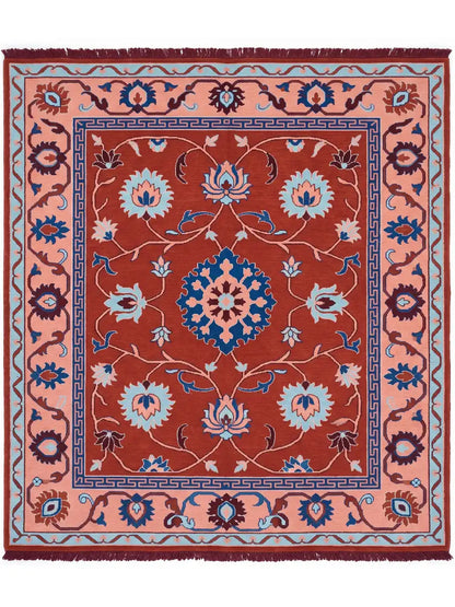 A square traditional area rug with a rust red center