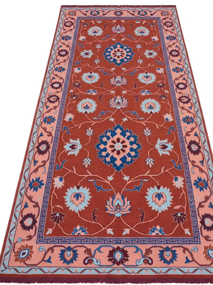 a traditional hand knotted runner rug in rust shade