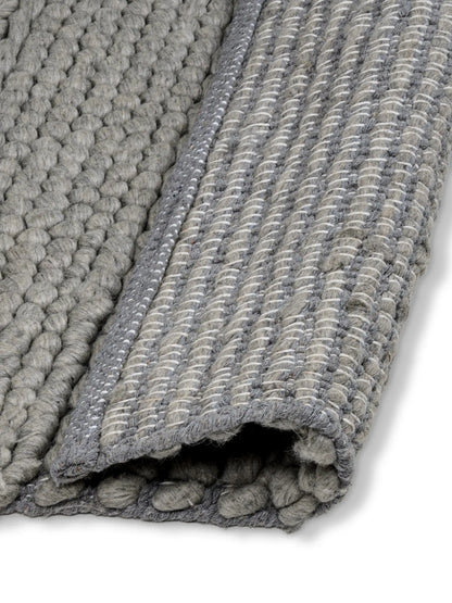 front and back side of hand woven area rug