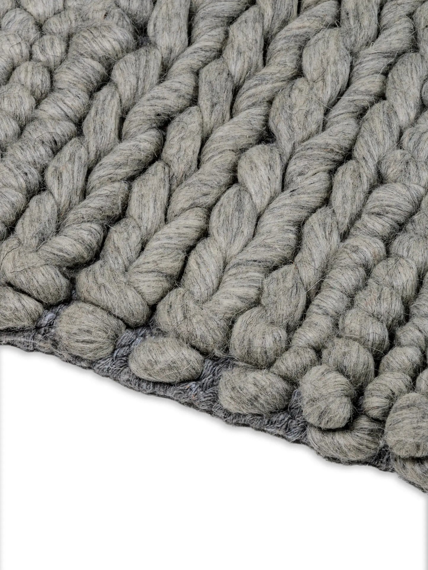 Close-up of gray textured wool area rug