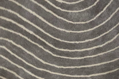 close up of a grey round rug