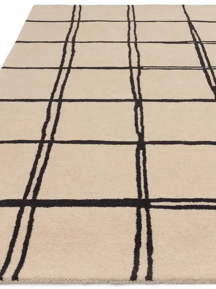beige and black grid pattern carpet close up