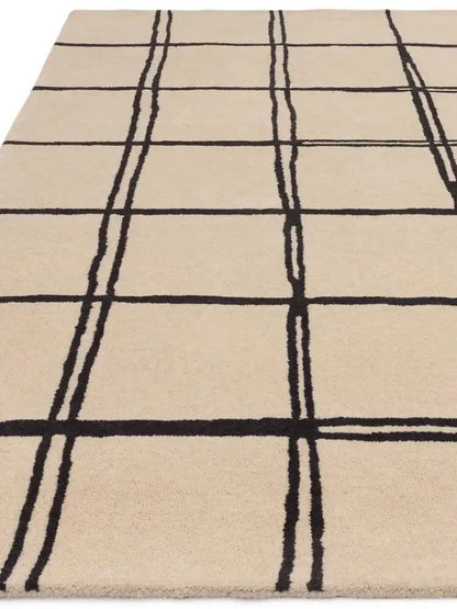 beige and black grid pattern carpet close up