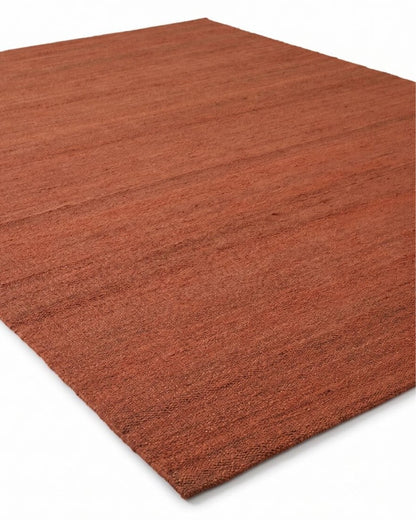 hand woven natural jute rug in rust red