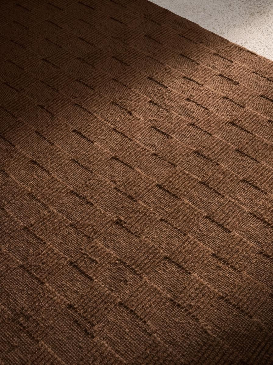 Close-up of a textured brown wool rug