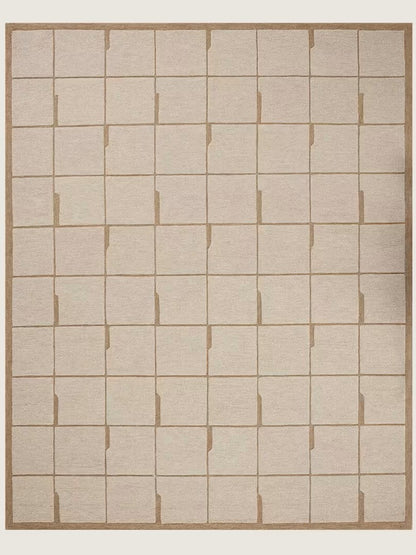Beige hand tufted wool area rug with a grid pattern