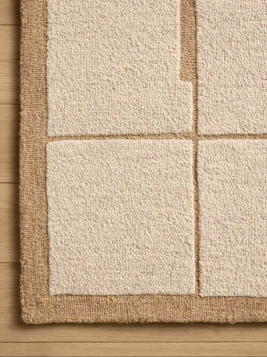 Close-up of a textured beige wool rug