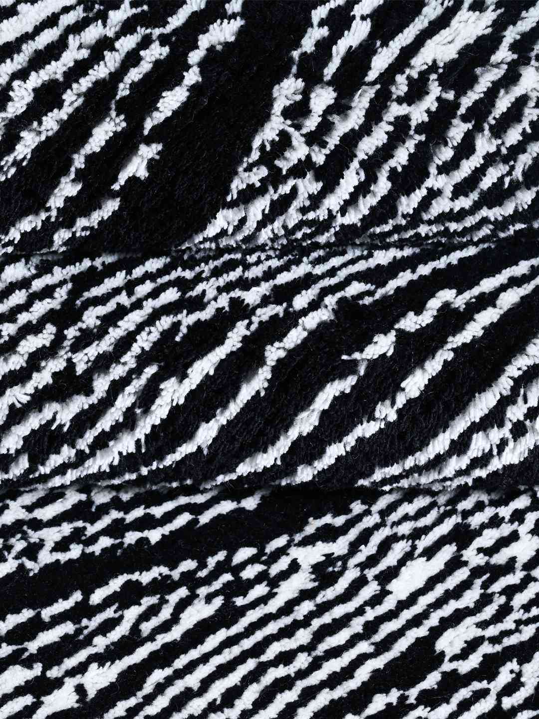 wave black and white hand knotted wool rug closeup