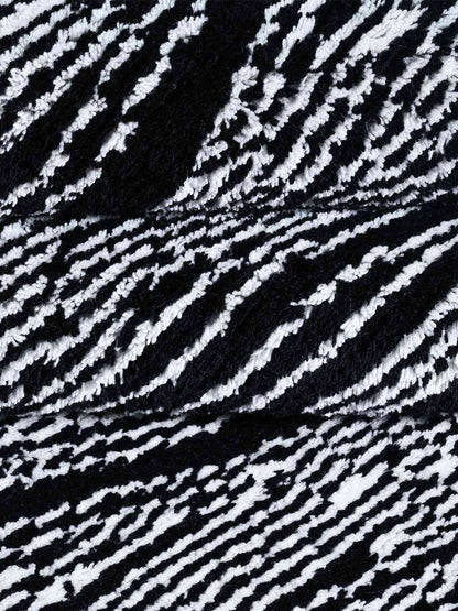 wave black and white hand knotted wool rug closeup