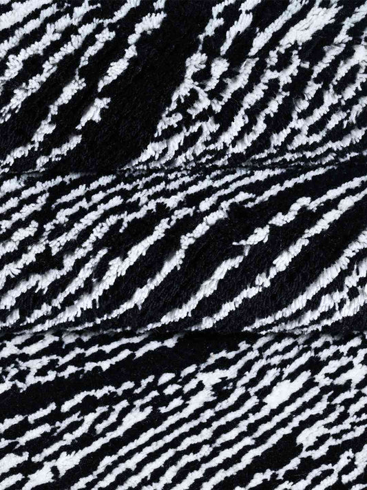 wave black and white hand knotted wool rug closeup