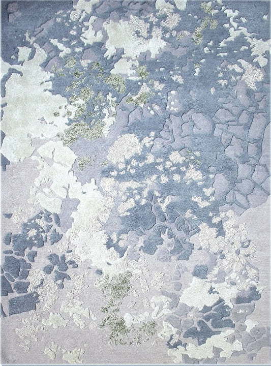 premium hand tufted textured wool and silk rug with a pattern of light blue, gray, and white colors.