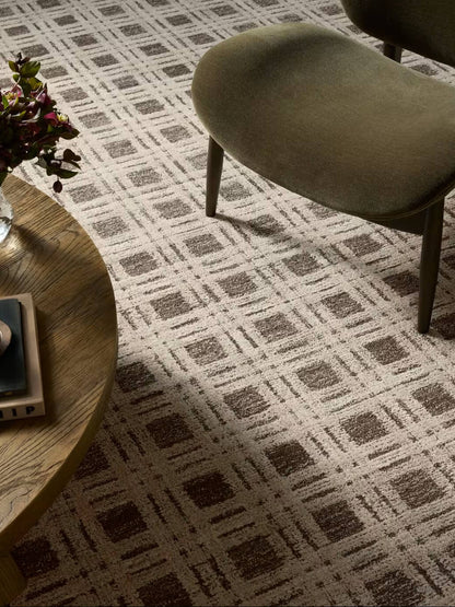 check hand tufted wool rug in living area